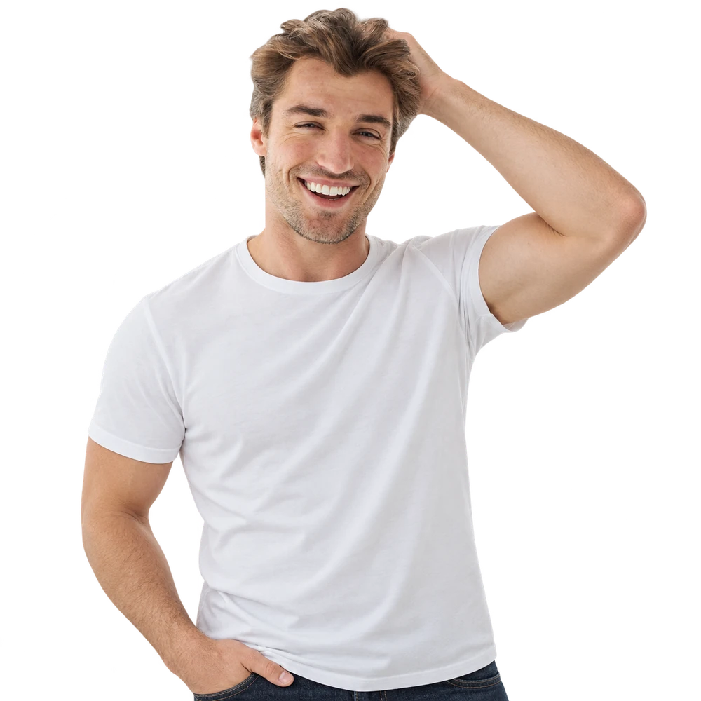 A man running a hand through a full head of hair